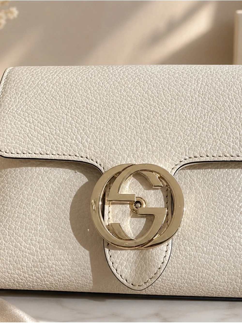 Gucci Cream Pebbled Leather Crossbody with Gold GG Chain